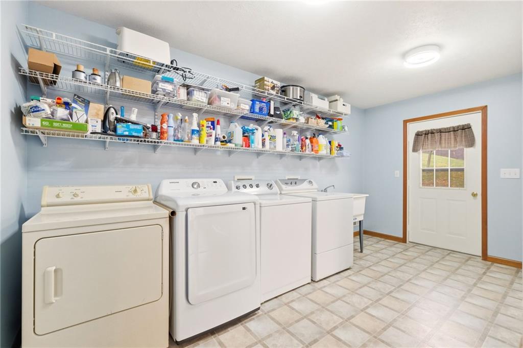 327 Sugar Run Road Waynesburg, PA 15370 - Photo 12 of 29 a utility room with dryer and washer