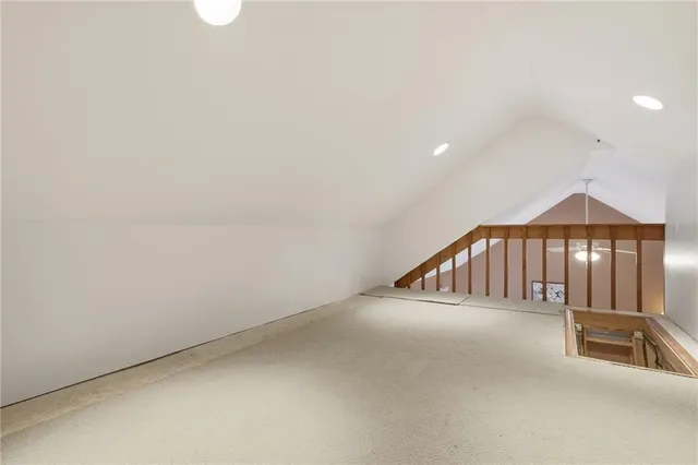 a view of a balcony with wooden floor and a yard