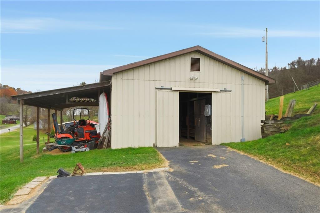 327 Sugar Run Road Waynesburg, PA 15370 - Photo 23 of 29 a front view of a house with garden