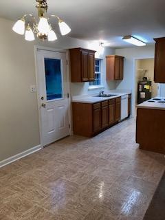 4247 Fairview Road Columbia, TN 38401 - Photo 5 of 6 a large kitchen with kitchen island granite countertop stainless steel appliances and white cabinets