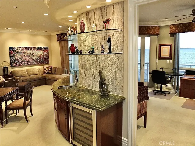 a kitchen with stainless steel appliances granite countertop a stove and a refrigerator
