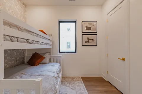 a bathroom with a sink toilet vanity and bathtub
