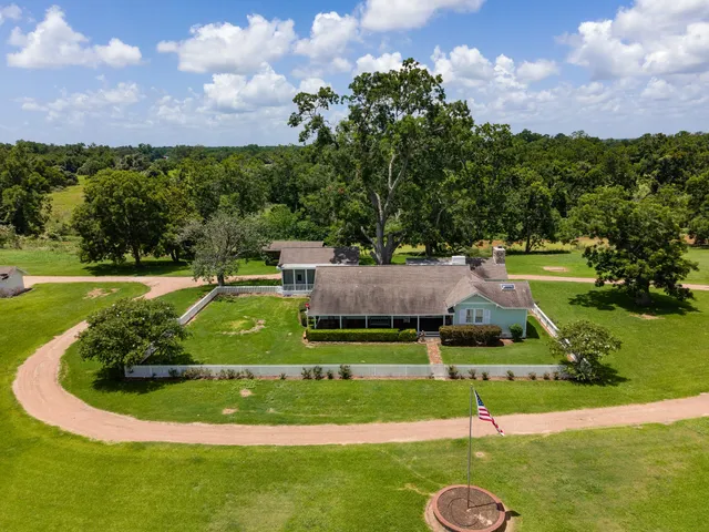 a view of a house with a big yard