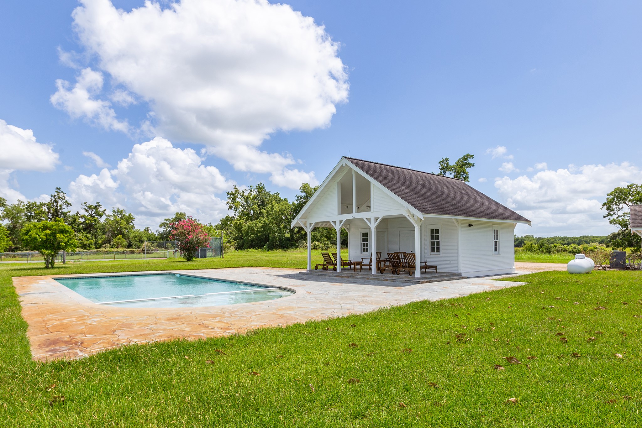 2908 Robichaux Road Pattison, TX 77423 - Photo 46 of 50 a view of a house with a yard patio and swimming pool