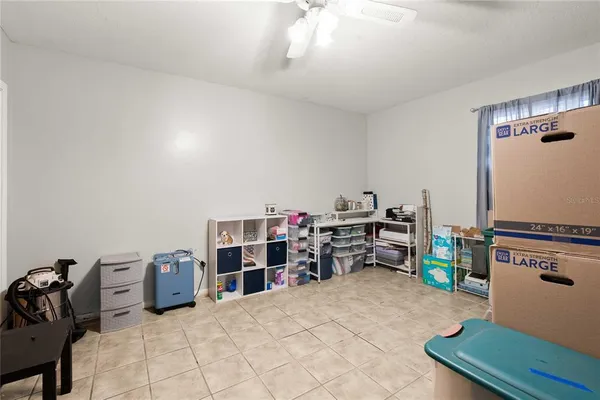 a bedroom with furniture and a book shelf