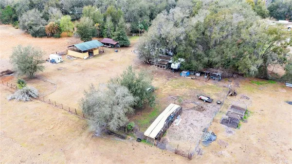 a view of backyard with swimming pool