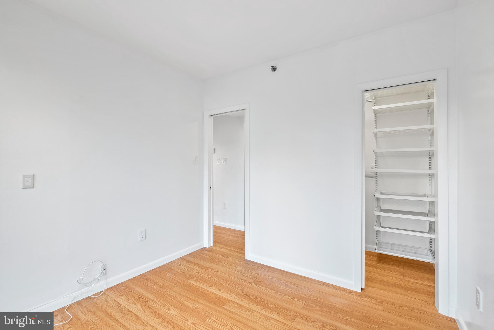 1530 Key Boulevard, Unit 930 Arlington, VA 22209 - Photo 11 of 20 a view of a room with wooden floor