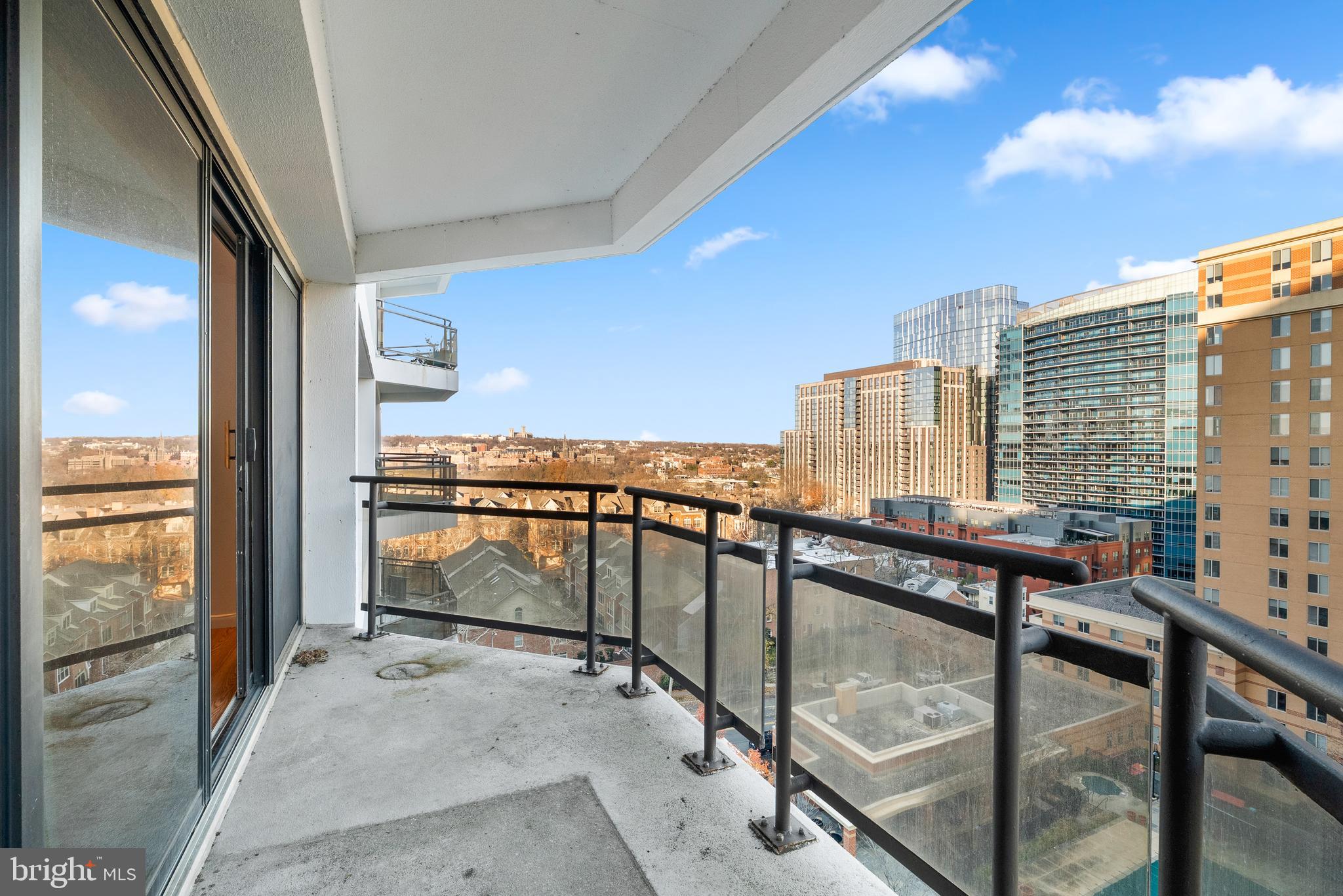 1530 Key Boulevard, Unit 930 Arlington, VA 22209 - Photo 18 of 20 a view of a balcony with furniture and city view