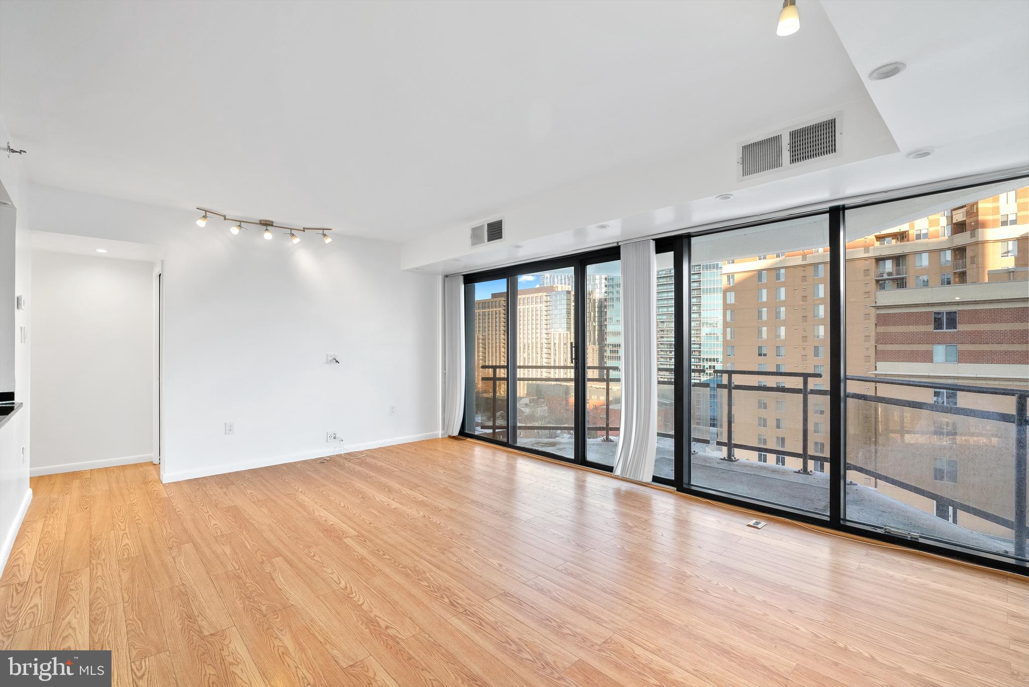 1530 Key Boulevard, Unit 930 Arlington, VA 22209 - Photo 5 of 20 a view of an empty room with a window