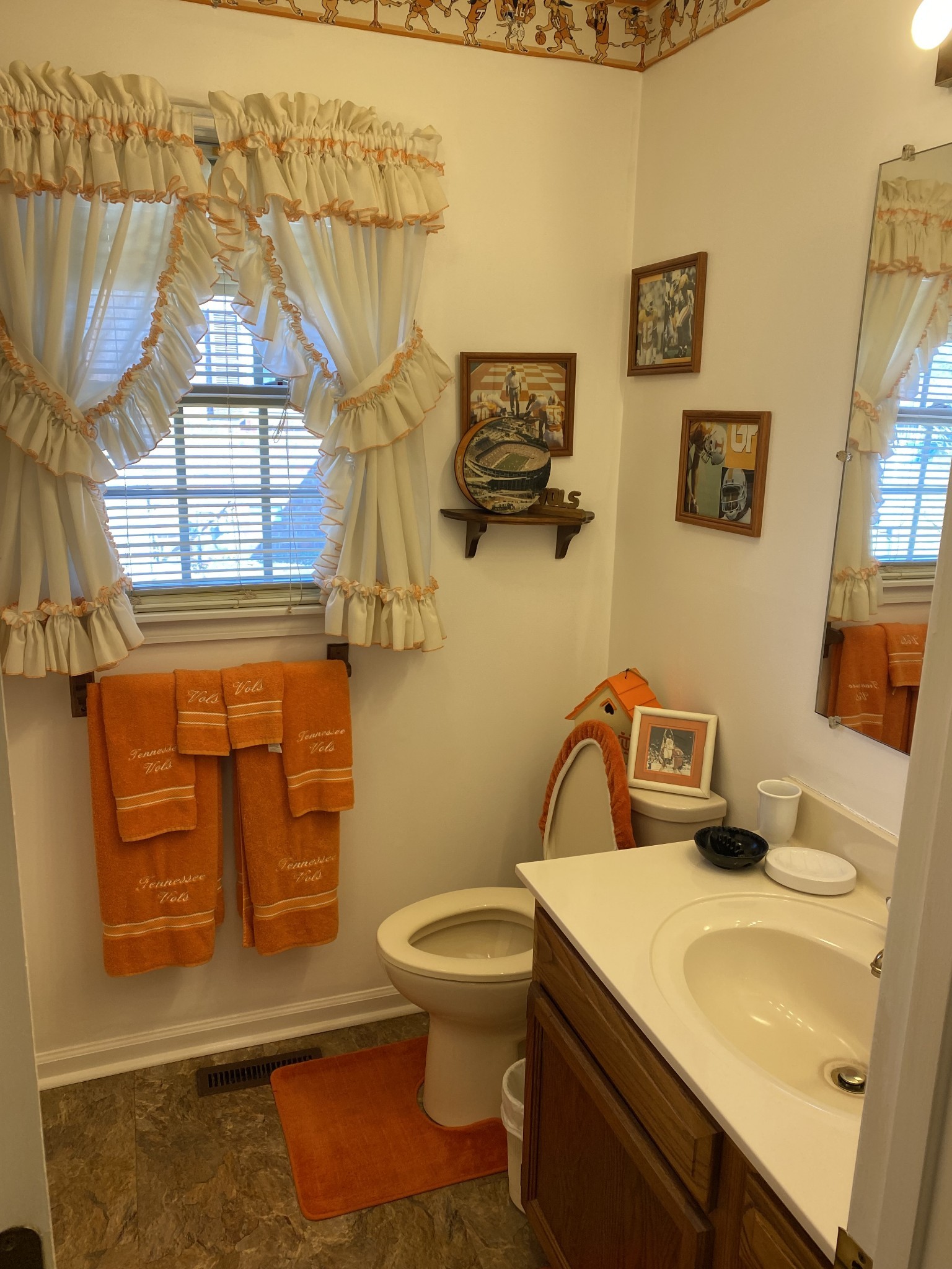 1306 McMahan Street Manchester, TN 37355 - Photo 35 of 48 a bathroom with a toilet sink and mirror