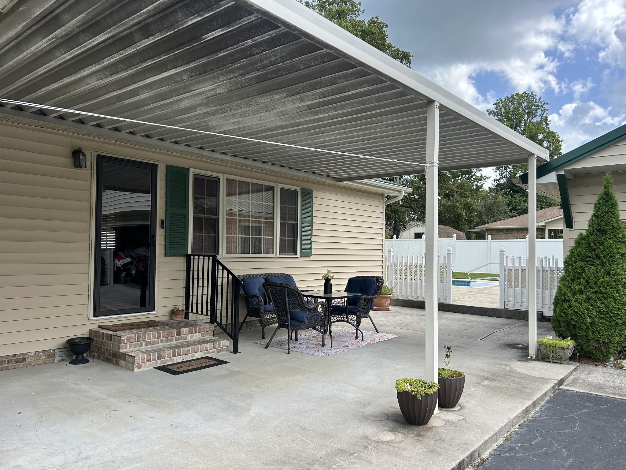 1306 McMahan Street Manchester, TN 37355 - Photo 40 of 48 a backyard with table and chairs