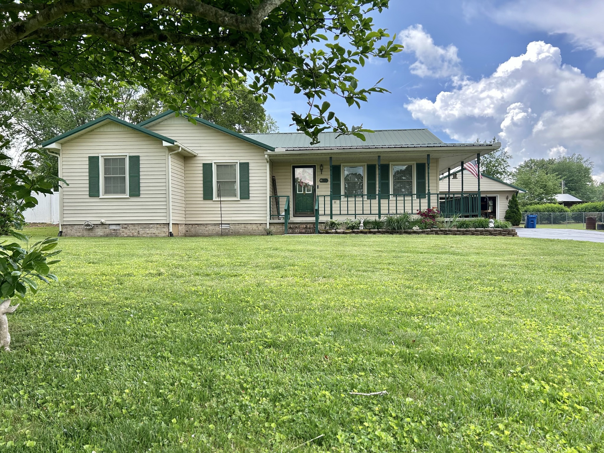 1306 McMahan Street Manchester, TN 37355 - Photo 5 of 48 a front view of a house with a yard