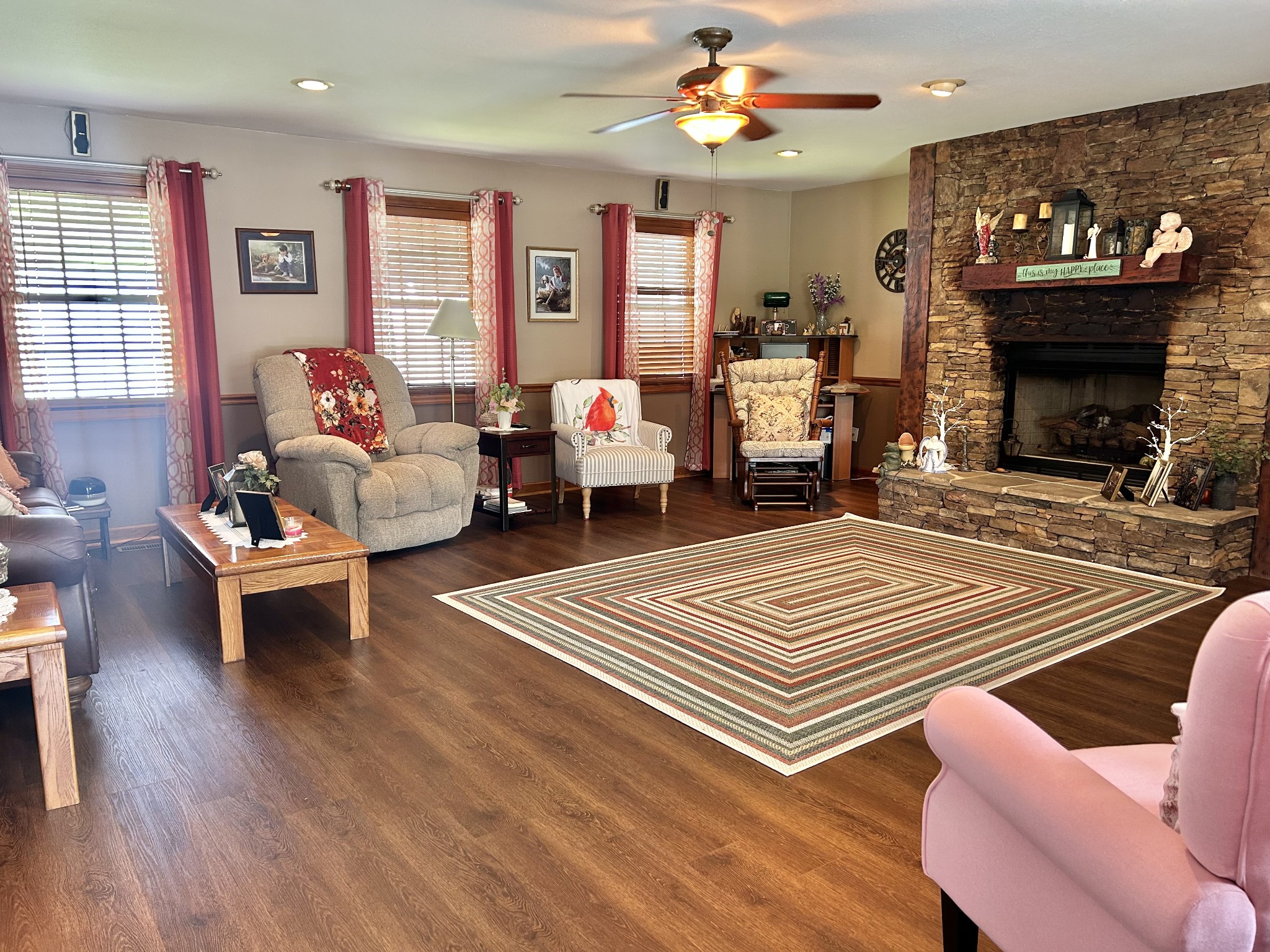 1306 McMahan Street Manchester, TN 37355 - Photo 8 of 48 a bedroom with a bed a couches and a fireplace