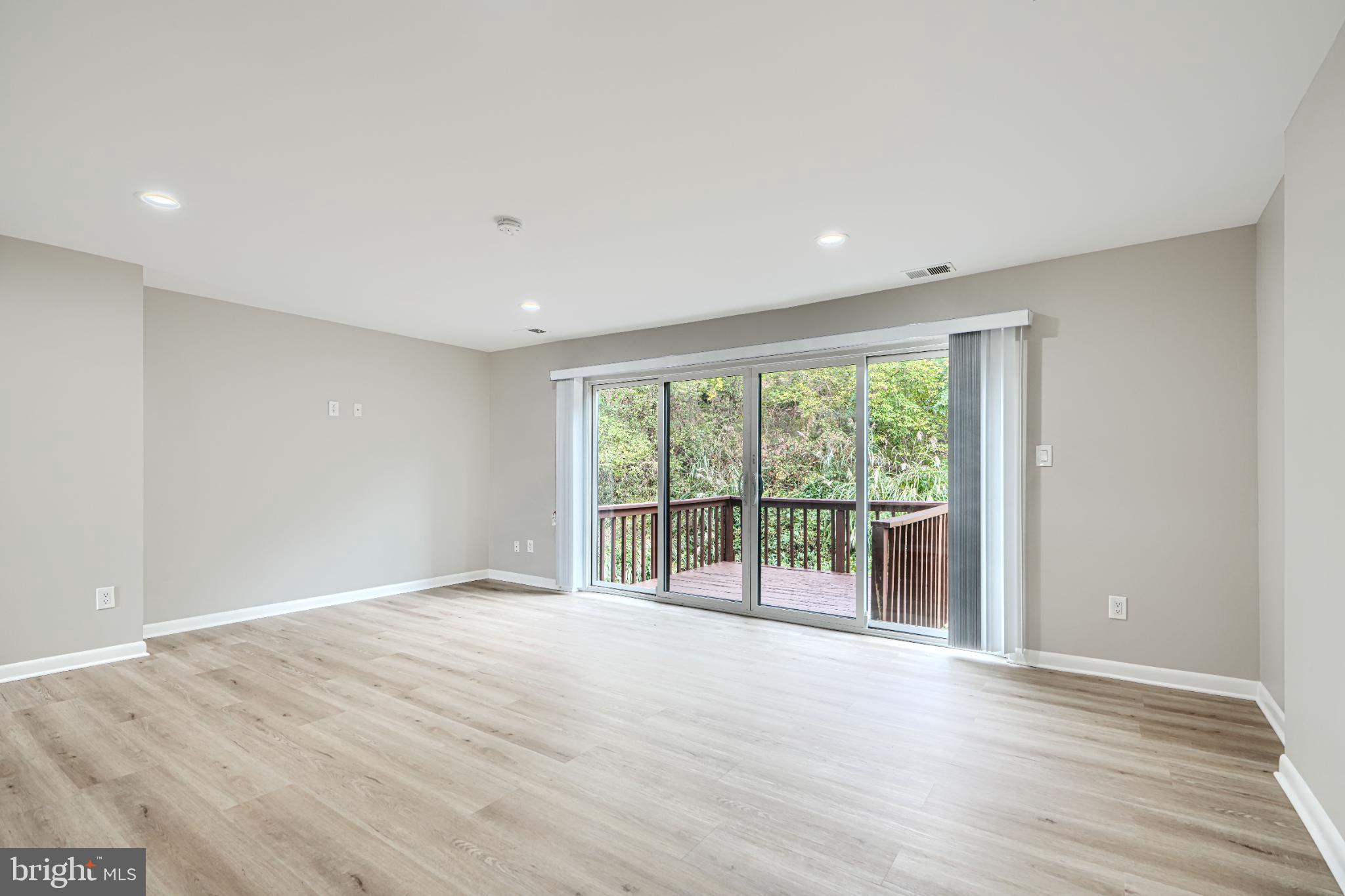 5520 Vantage Point Road Columbia, MD 21044 - Photo 12 of 28 a view of an empty room with wooden floor and a window