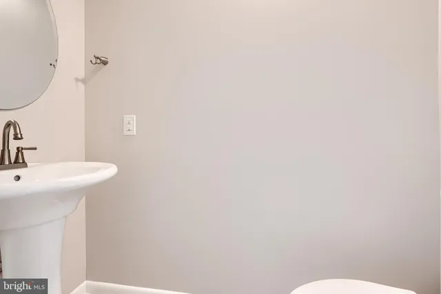 a bathroom with a sink a toilet