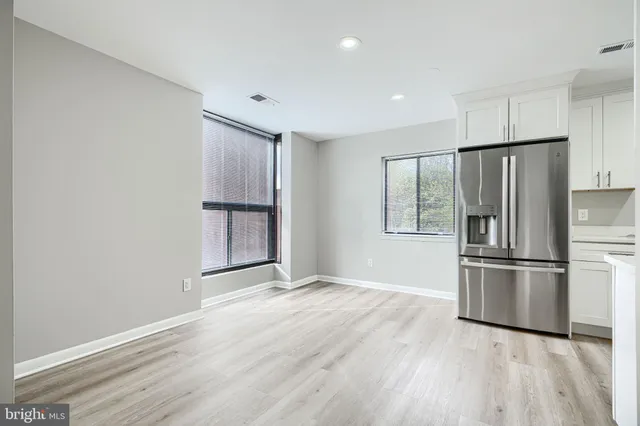 a kitchen with a refrigerator freezer and a dishwasher