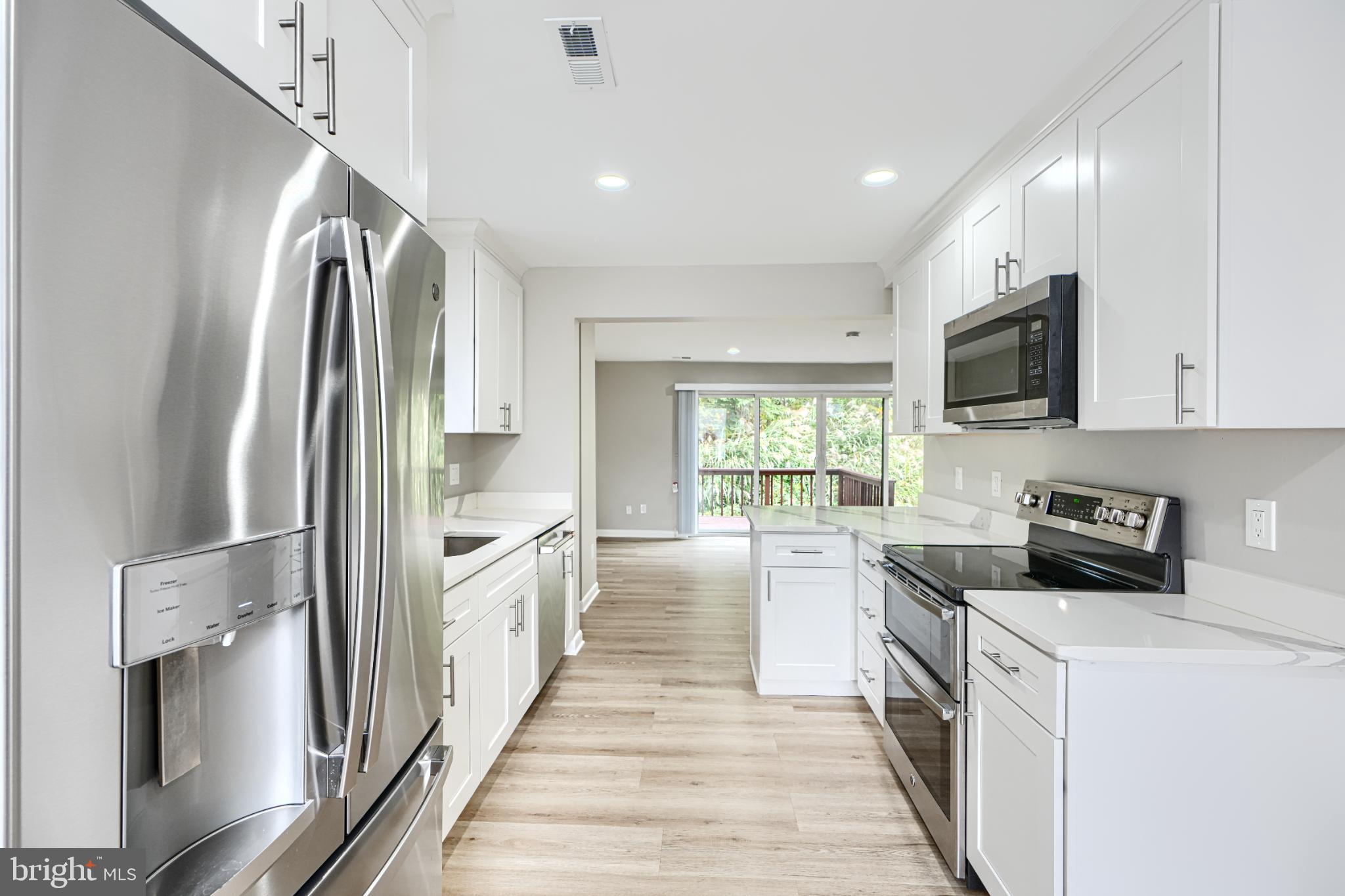 5520 Vantage Point Road Columbia, MD 21044 - Photo 16 of 28 a kitchen with stainless steel appliances a stove a sink and a refrigerator