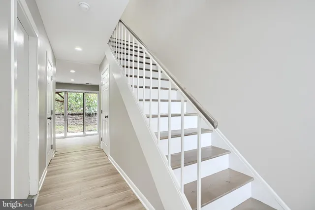 a view of entryway with wooden floor