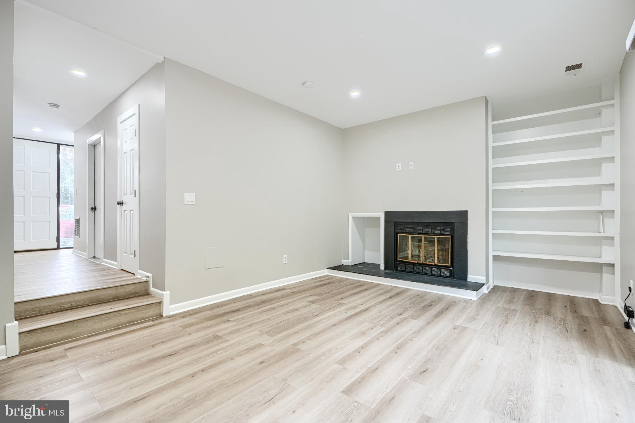 5520 Vantage Point Road Columbia, MD 21044 - Photo 7 of 28 a view of an empty room with a fireplace and a window