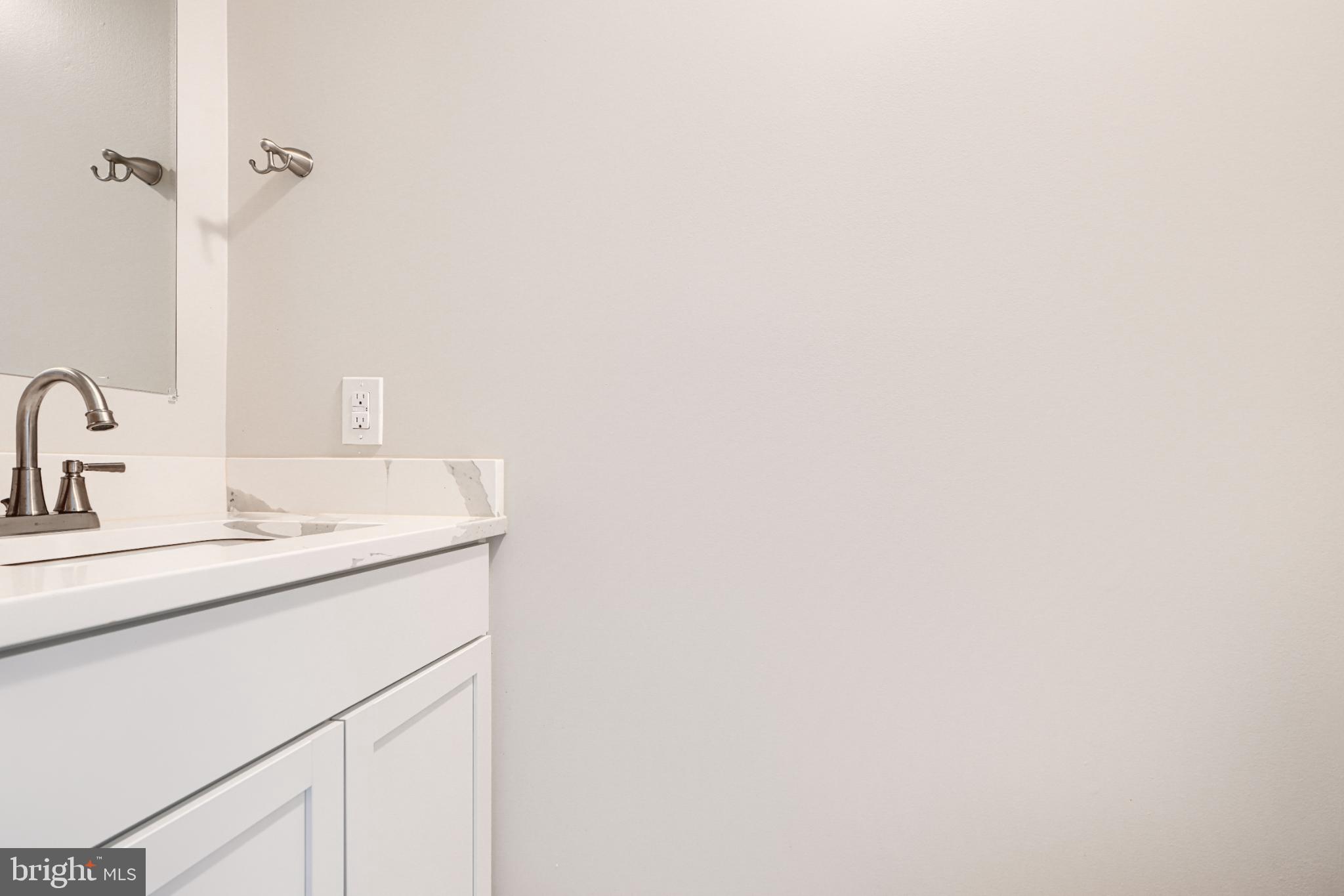 5520 Vantage Point Road Columbia, MD 21044 - Photo 8 of 28 a bathroom with a sink and a mirror