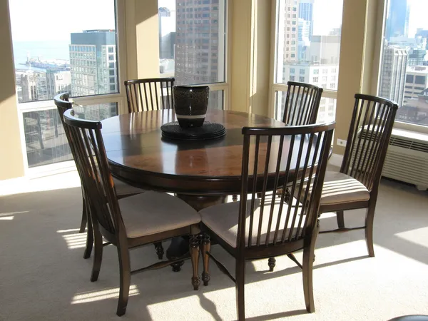 a view of a dining room with furniture window and wooden floor