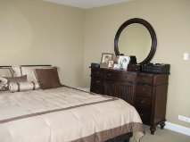 111 East Chestnut Street, Unit 45K Chicago, IL 60611 - Photo 9 of 15 a bedroom with a bed and a dresser