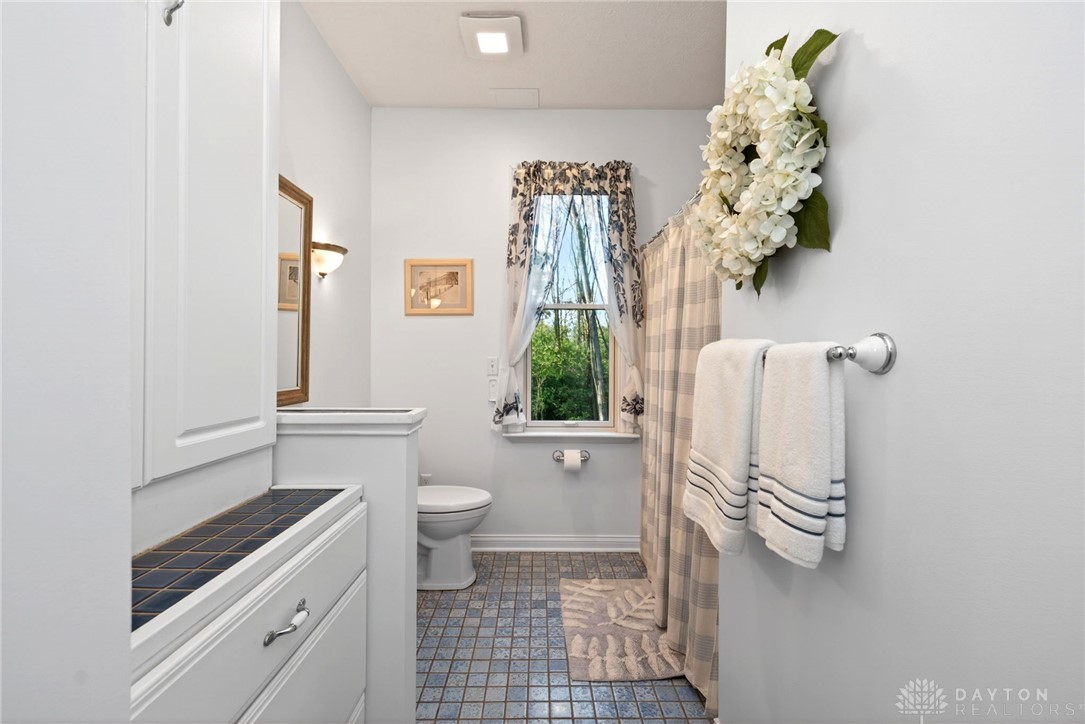 330 South Alpha Bellbrook Road Bellbrook, OH 45305 - Photo 30 of 87 This bright bathroom features a window, providing natural light.