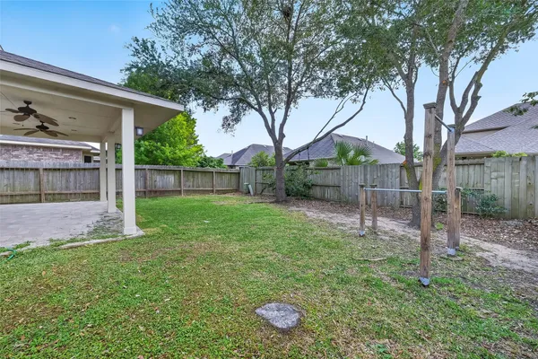 a backyard of a house with lots of green space
