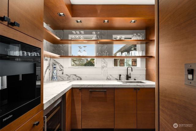 a kitchen with a sink and cabinets