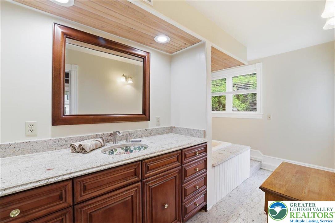 3585 Fairyland Road Lehighton, PA 18235 - Photo 38 of 57 a bathroom with a granite countertop sink a mirror and a