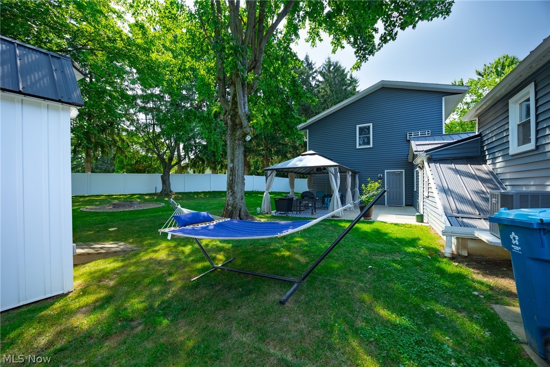 6595 Grove Road Clinton, OH 44216 - Photo 17 of 18 View of yard featuring a patio and a gazebo