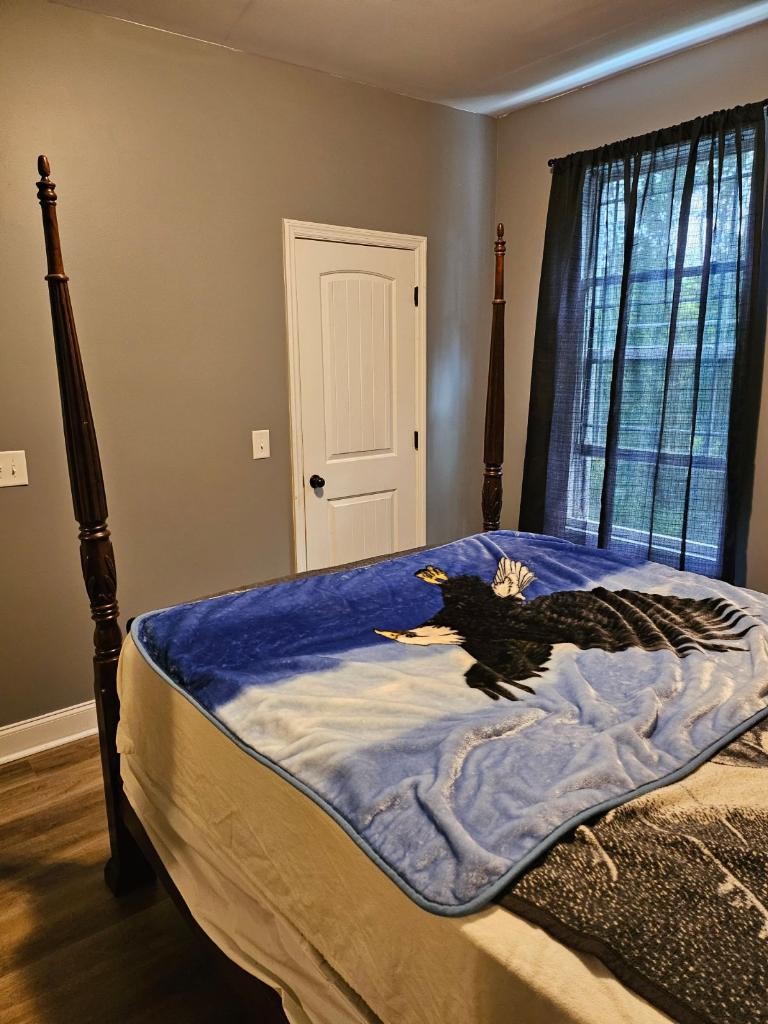 511 Franklin Road Gallatin, TN 37066 - Photo 27 of 47 a bed sitting in a bedroom next to a window