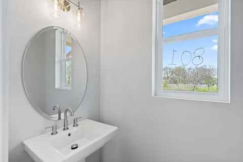 a bathroom with a sink and mirror