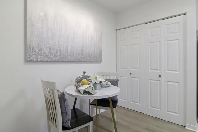 a view of a table and chairs in a kitchen