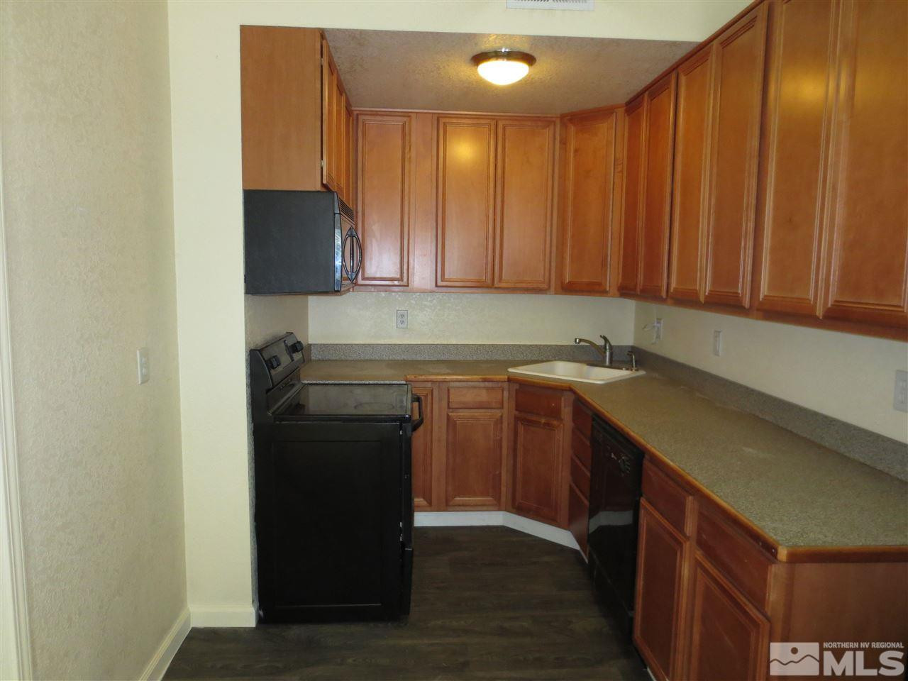 1045 Litch Court Reno, NV 89509 - Photo 3 of 18 a kitchen with a sink and cabinets