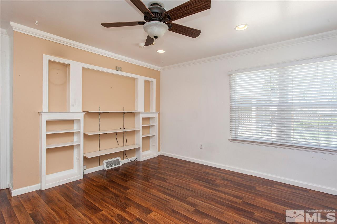 1045 Litch Court Reno, NV 89509 - Photo 5 of 18 a view of a room with wooden floor and a window