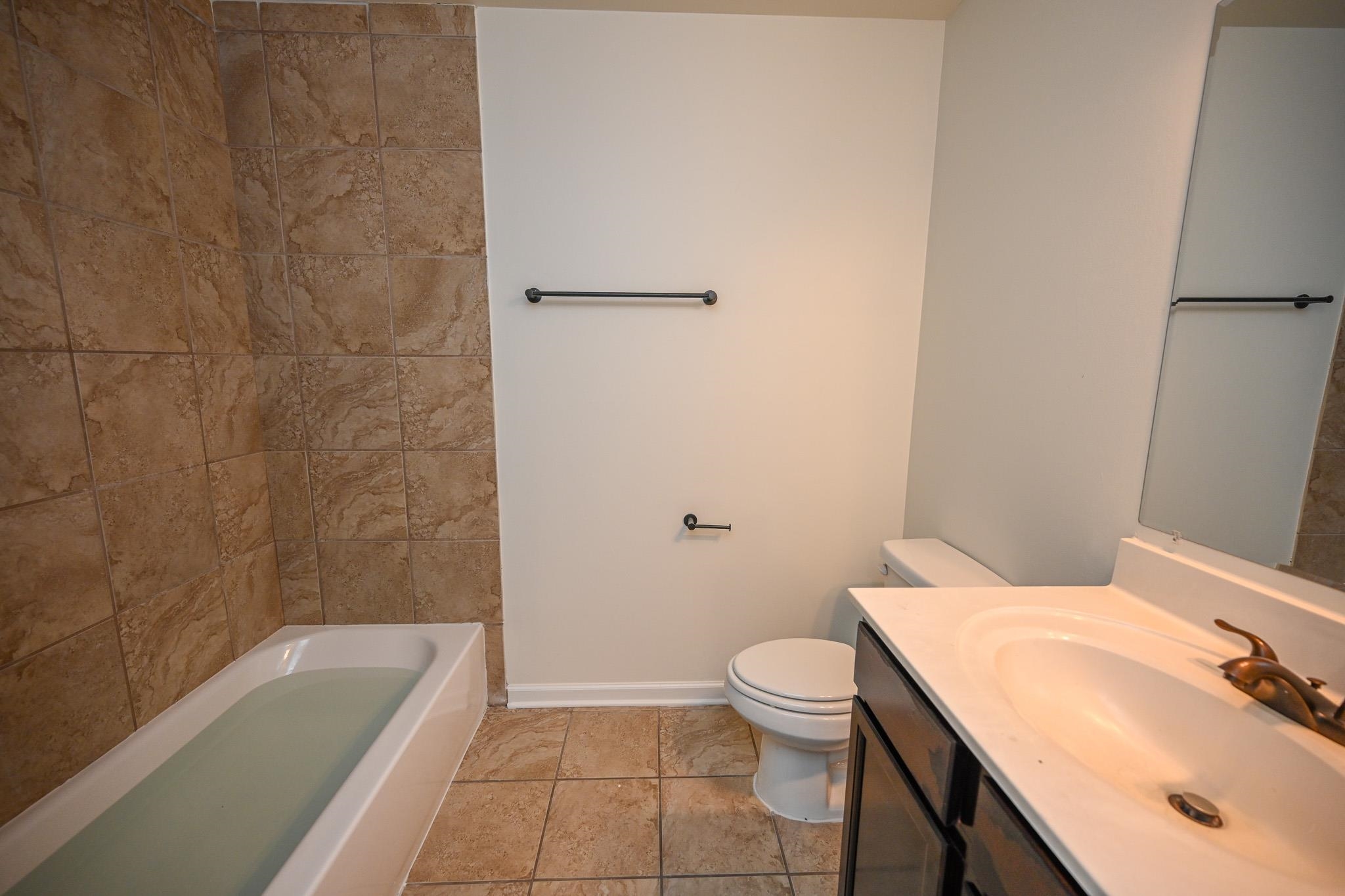 10249 Sterling Ridge Drive Cordova, TN 38018 - Photo 21 of 27 a bathroom with a sink a toilet and bathtub