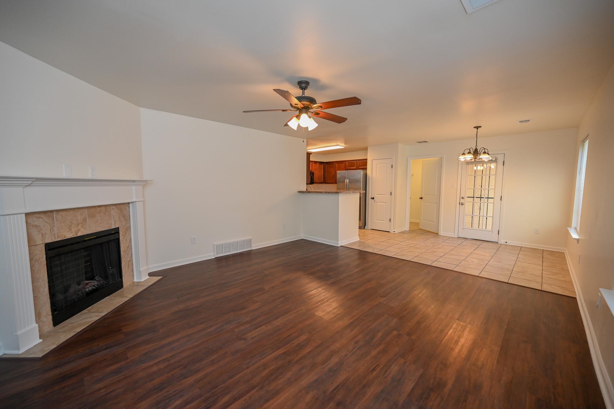 10249 Sterling Ridge Drive Cordova, TN 38018 - Photo 4 of 27 wooden floor in an empty room with a fireplace