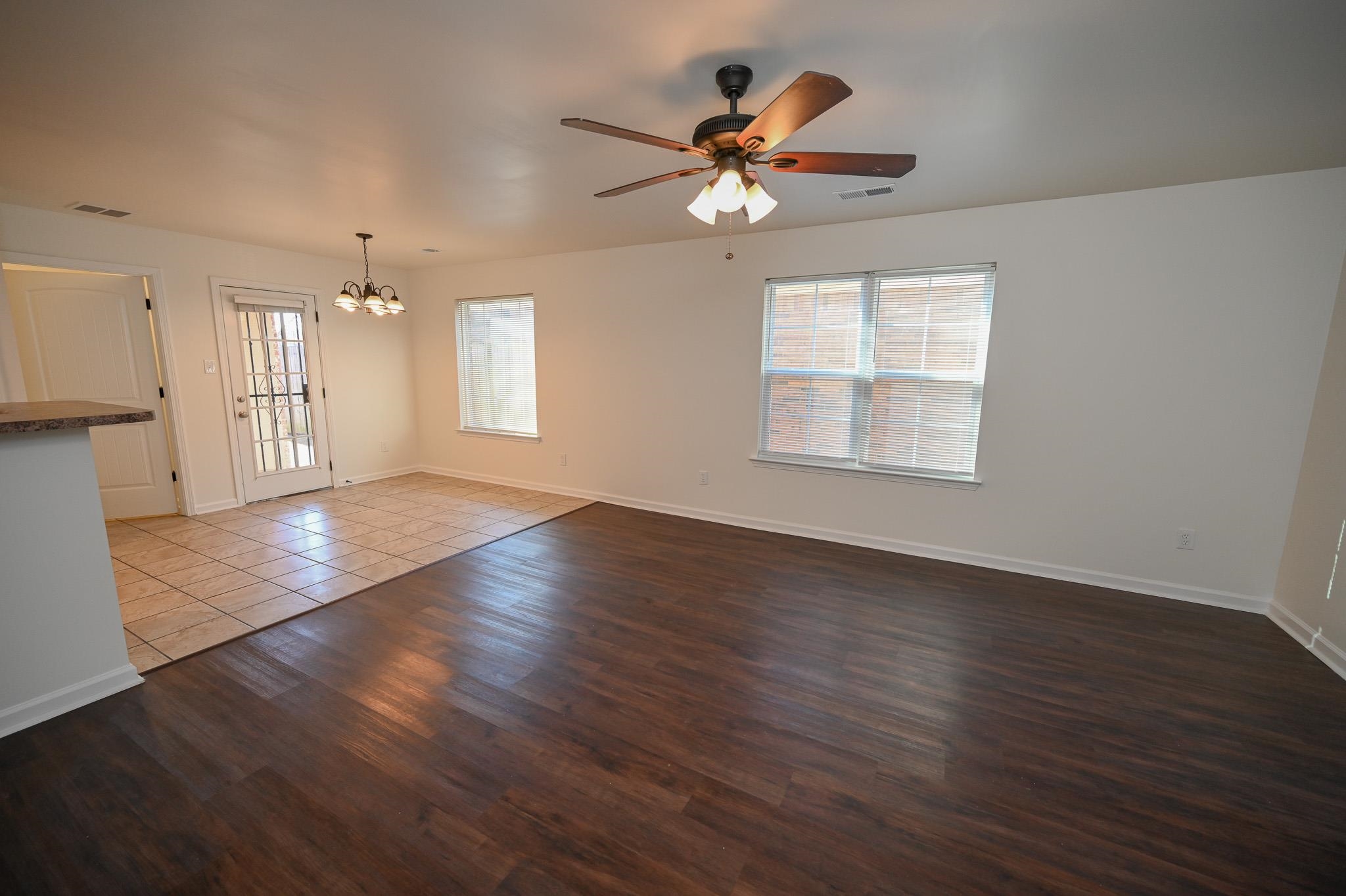 10249 Sterling Ridge Drive Cordova, TN 38018 - Photo 5 of 27 a view of an empty room with wooden floor and a window