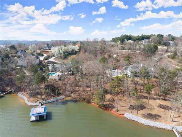 an aerial view of houses with yard