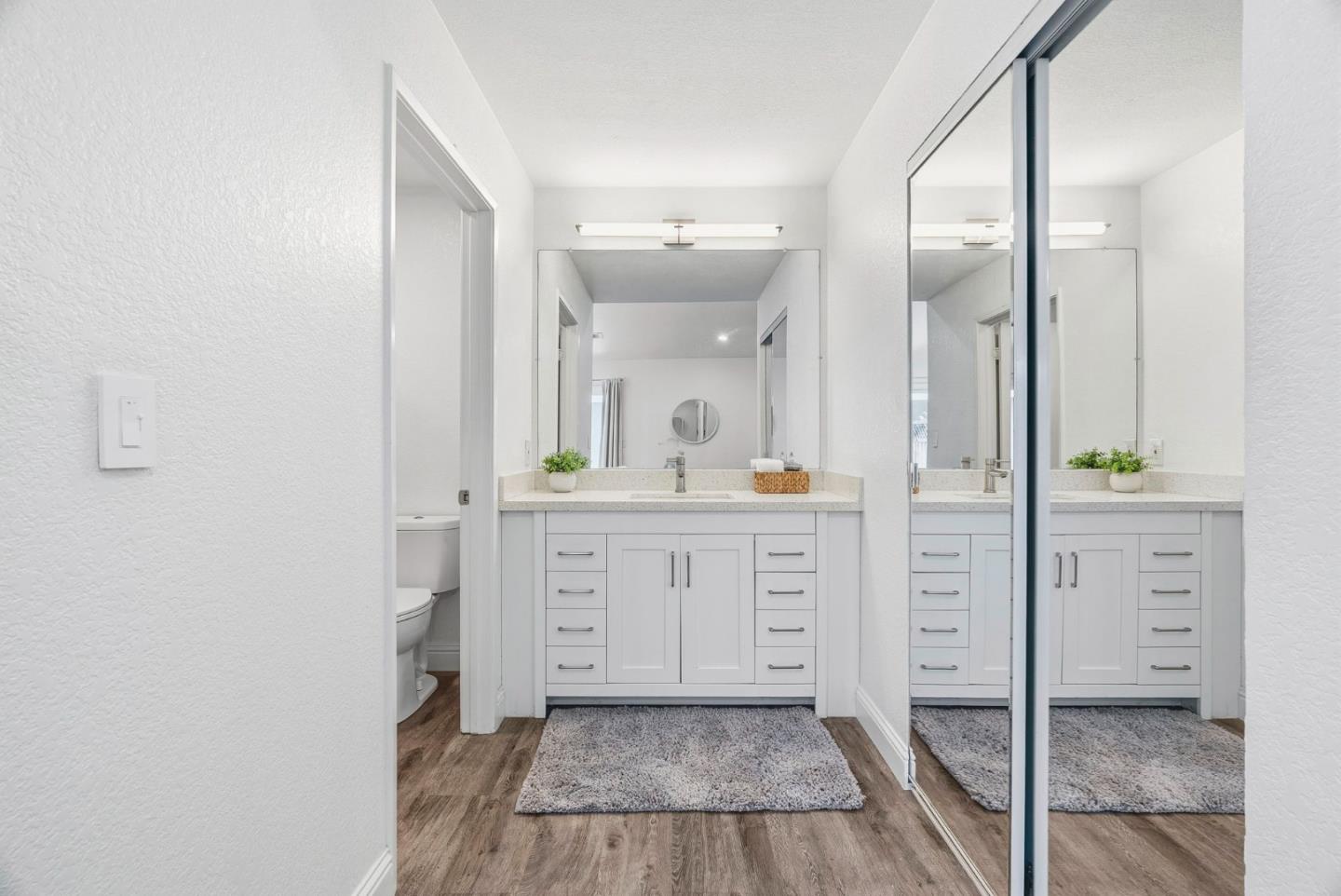 297 Perch Way Aptos, CA 95003 - Photo 25 of 42 a spacious bathroom with a shower sink and a mirror
