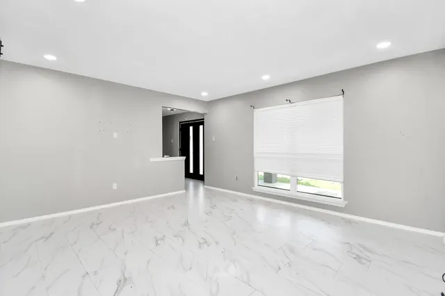 an empty room with windows