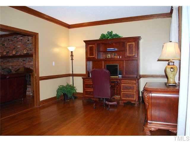 Spacious designated study, formal living or music room. Paneled pocket doors allow for privacy or slide open to connect space to family room. Dental molding, chair railing, and hardwood floors provide elegant and smart appeal. Studio/Study/Office