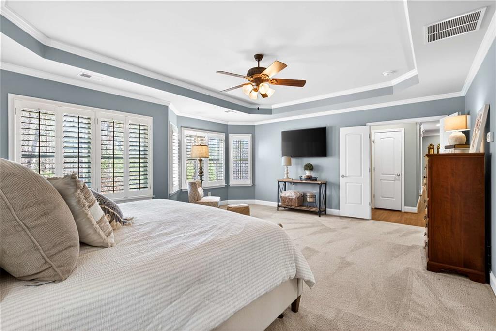 340 Scott Farm Drive Powder Springs, GA 30127 - Photo 26 of 59 a large bedroom with a bed and a large window