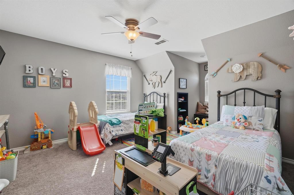 401 County Road 359, Unit B Merkel, TX 79536 - Photo 26 of 40 a bedroom with bed and a chandelier