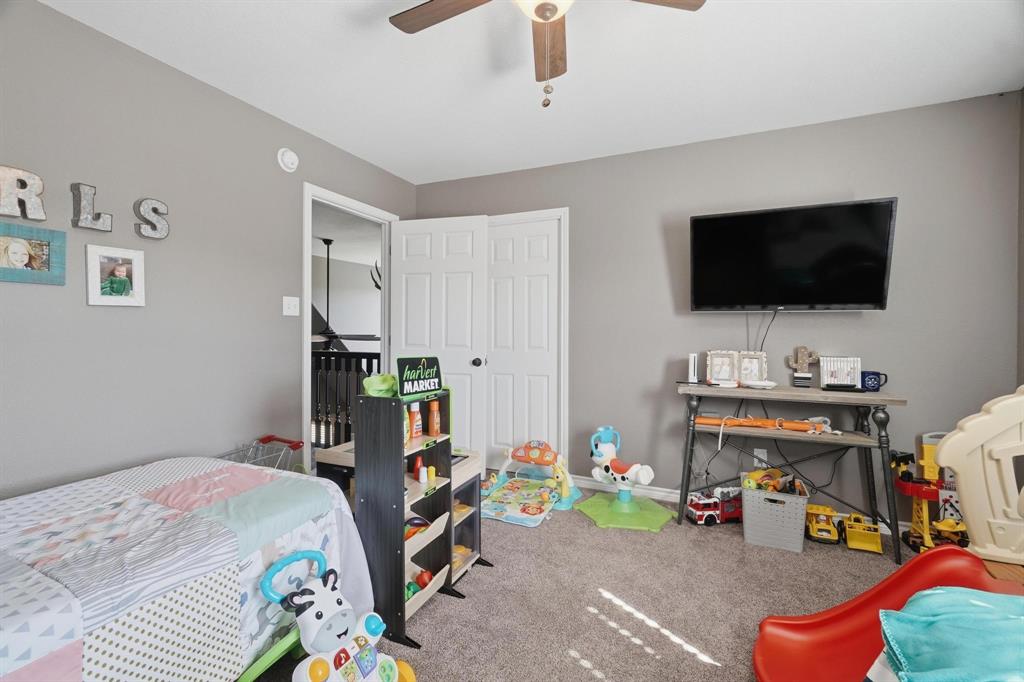 401 County Road 359, Unit B Merkel, TX 79536 - Photo 27 of 40 a bedroom with a bed and a flat screen tv