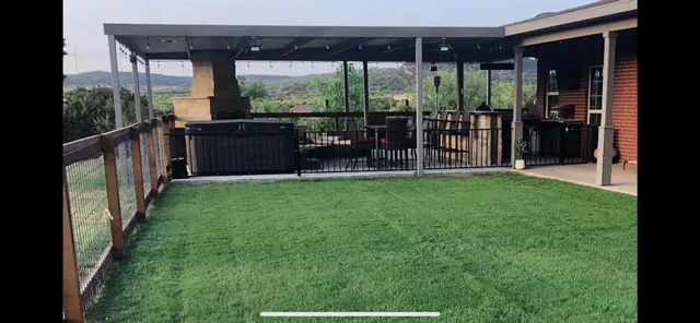 a view of a garden with a building in the background