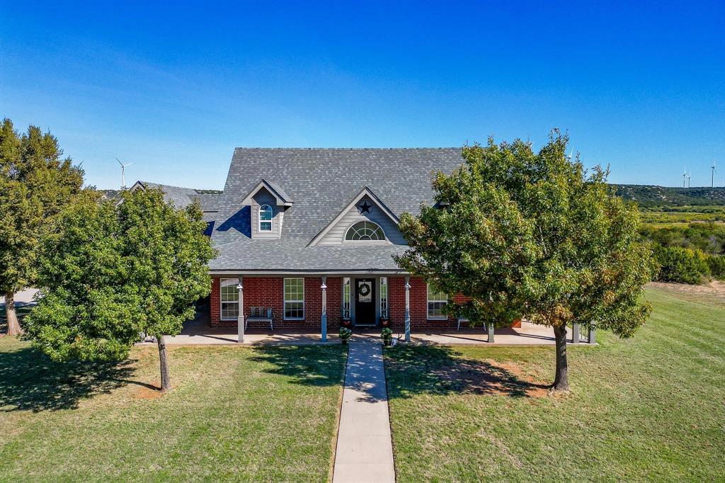 401 County Road 359, Unit B Merkel, TX 79536 - Photo 33 of 40 a front view of a house with garden