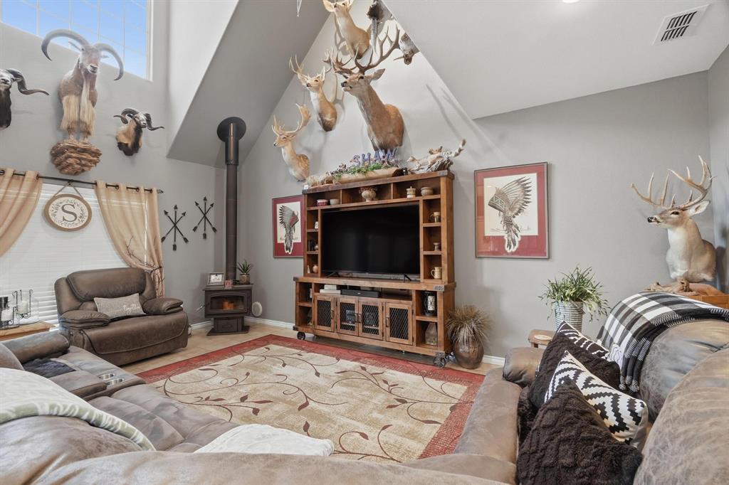 401 County Road 359, Unit B Merkel, TX 79536 - Photo 4 of 40 a living room with furniture and a flat screen tv