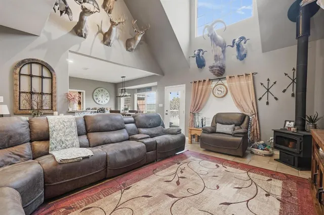 a living room with furniture and a mirror